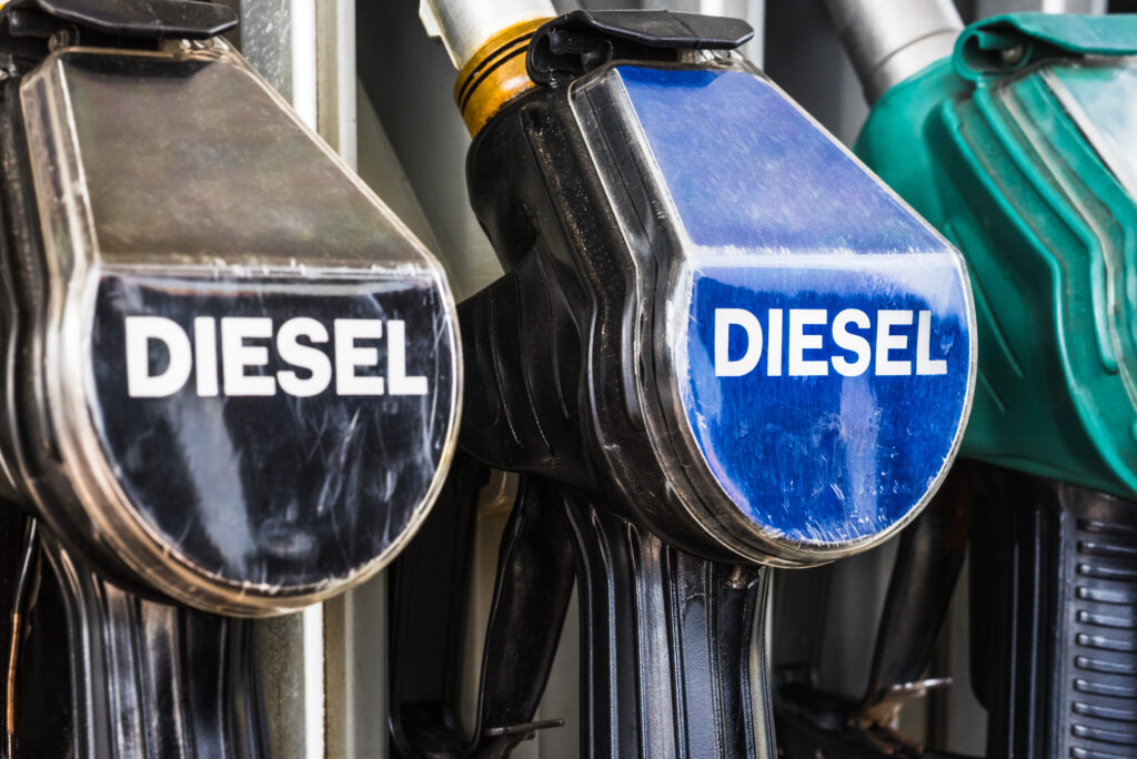 Diesel Fuel Pistols On A Gas Station Refueling Stand